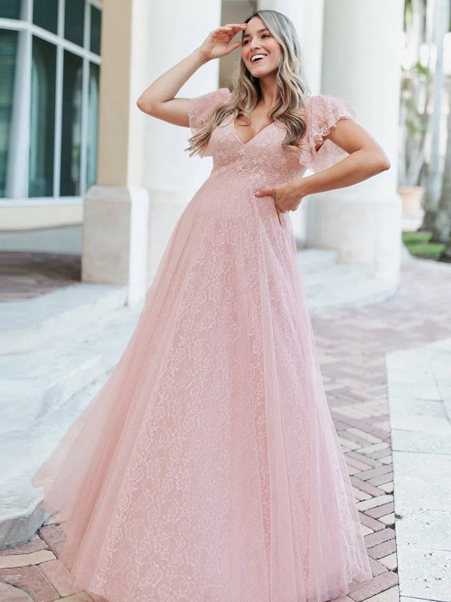 Long lace wedding dress with flutter sleeves and double V-neck.